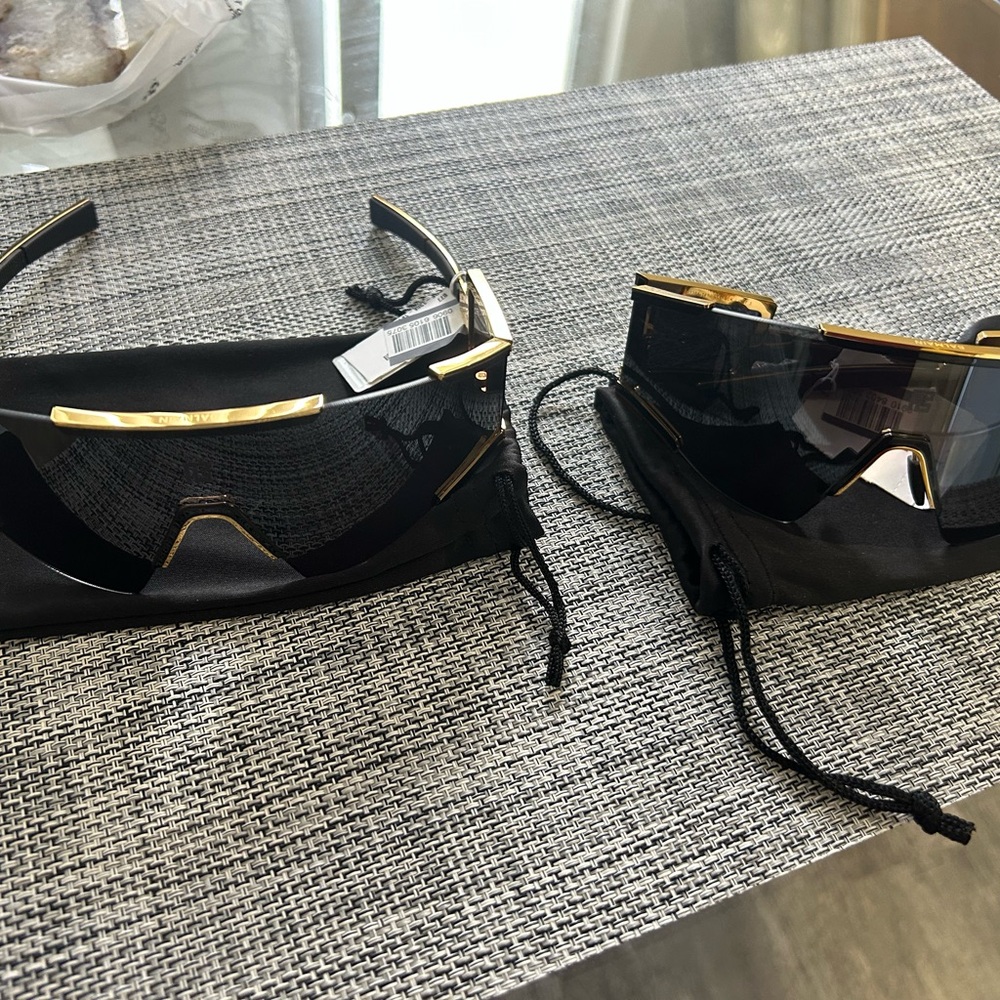 Balmain Black and Gold Sunglasses with Sleek Design